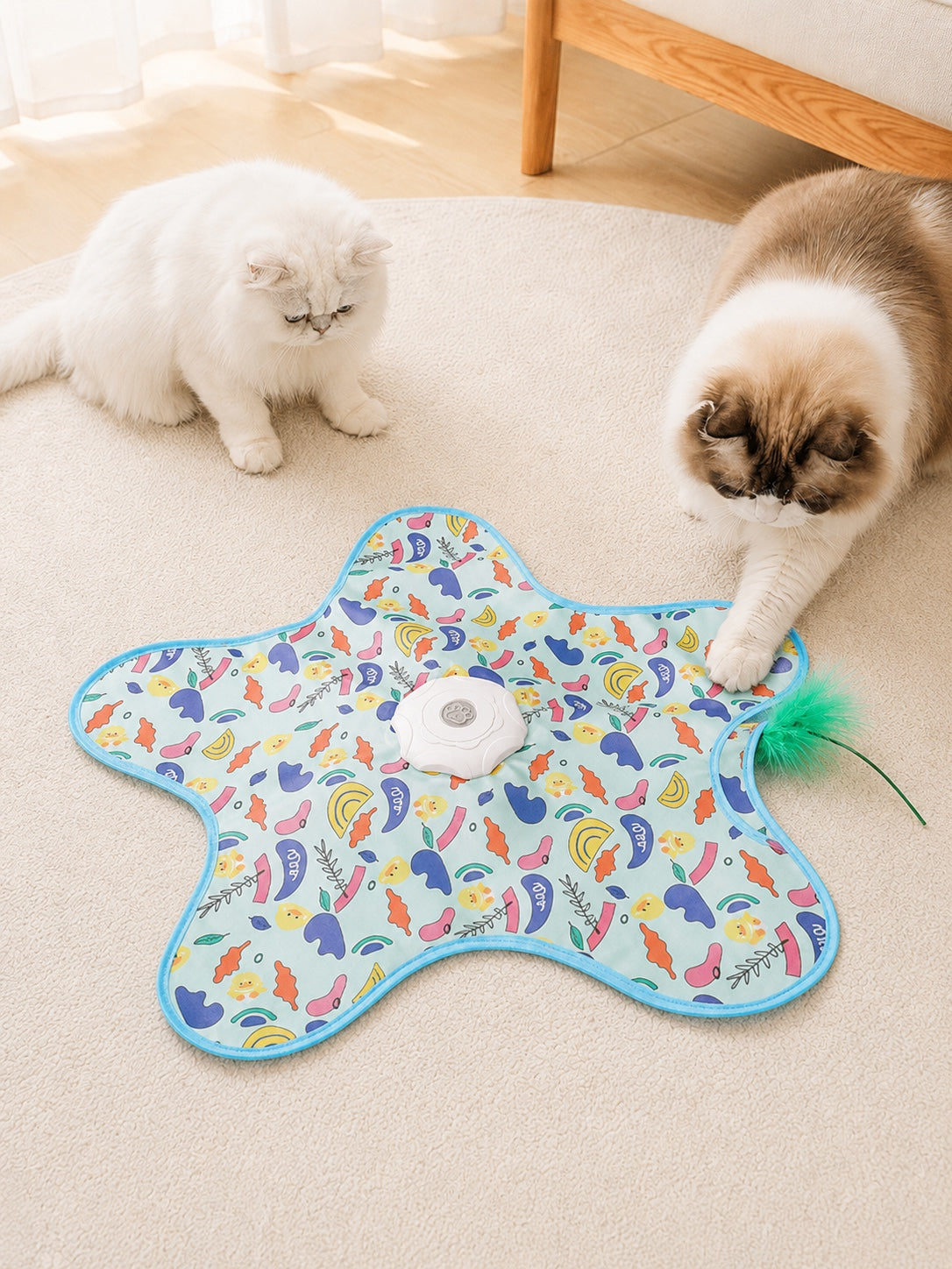 Two indoor cats playing with the Duck Pattern hide-and-seek cat toy mat