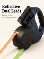 Reflective orange and green dual leash webbing close-up